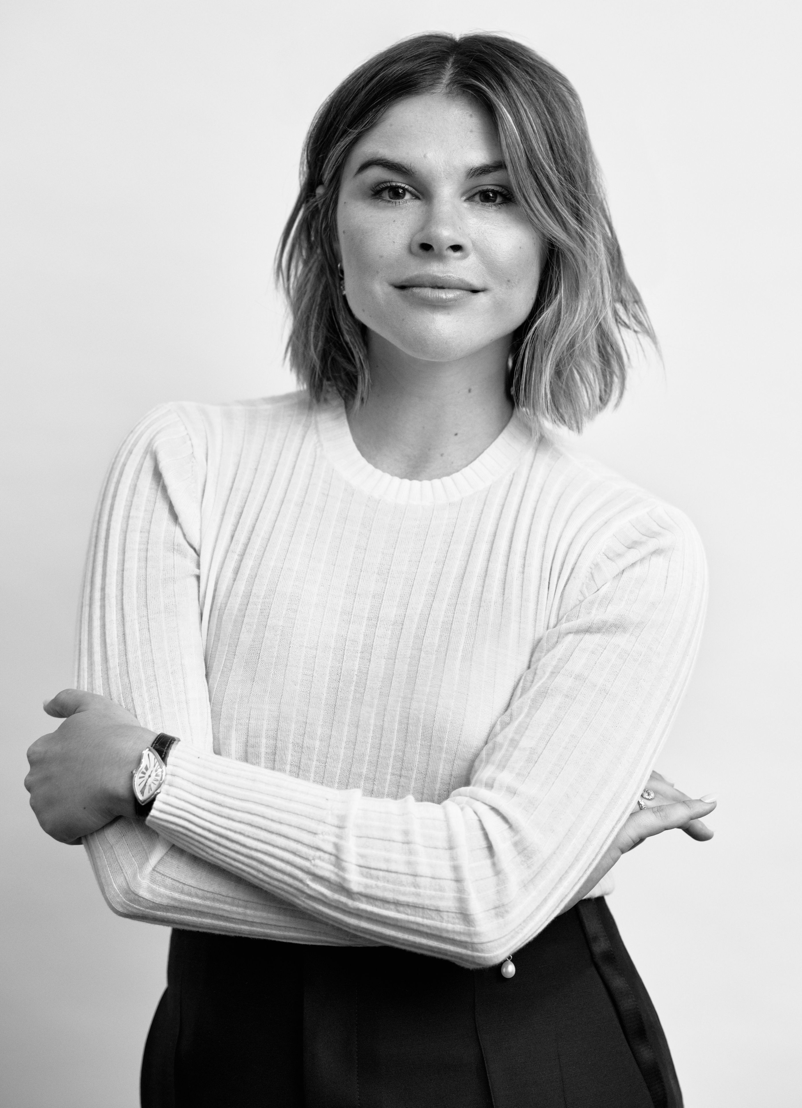 a brunette woman with her arms crossed