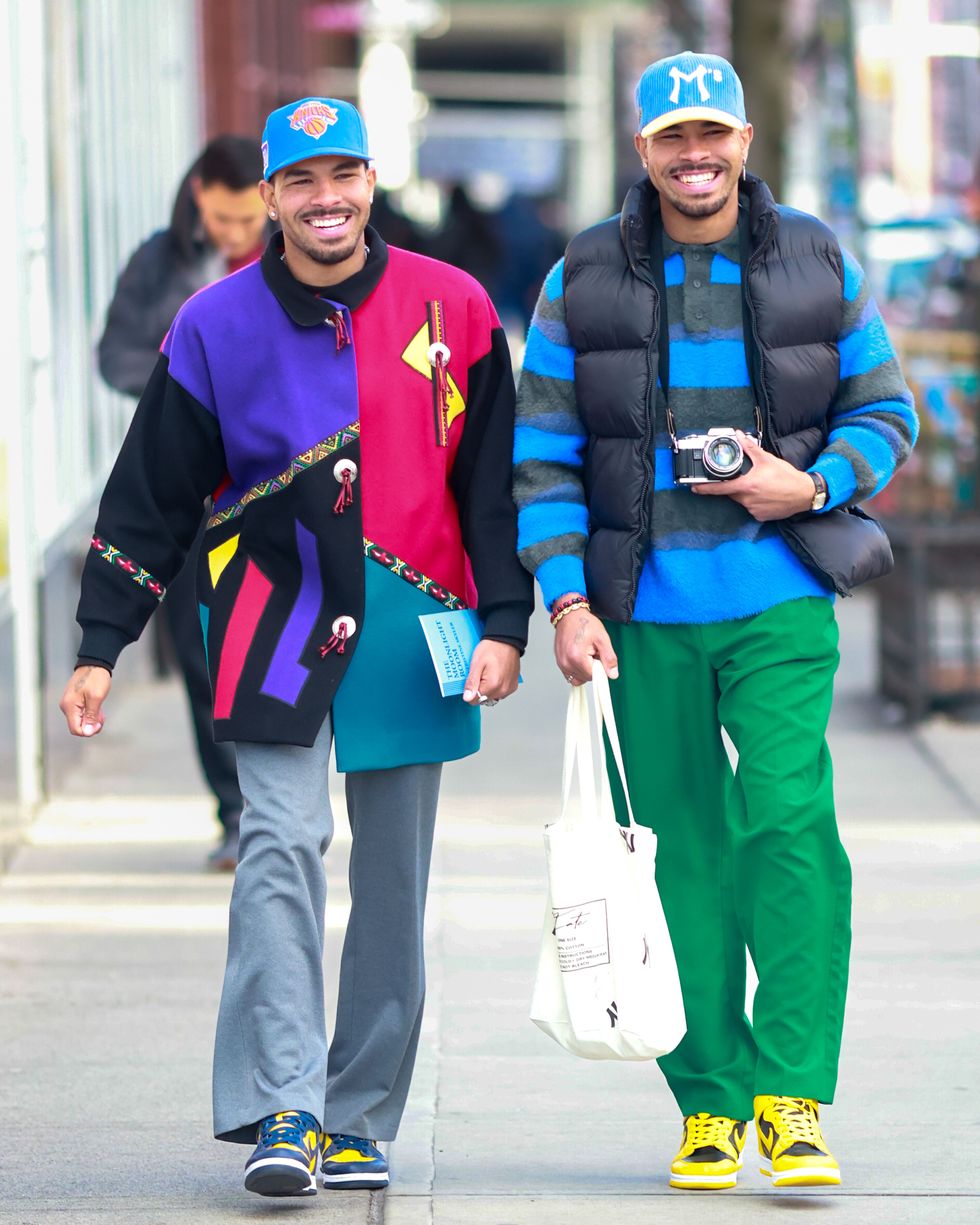 a couple of men smiling