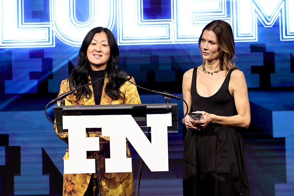 NEW YORK, NEW YORK - NOVEMBER 30: Sun Choe and Nikki Neuburger accept an award during the 2022 Footwear News Achievement Awards at Cipriani South Street on November 30, 2022 in New York City. (Photo by Jamie McCarthy/Footwear News via Getty Images)