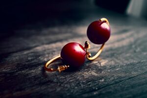 Elegant gold statement earrings displayed against minimalist white background