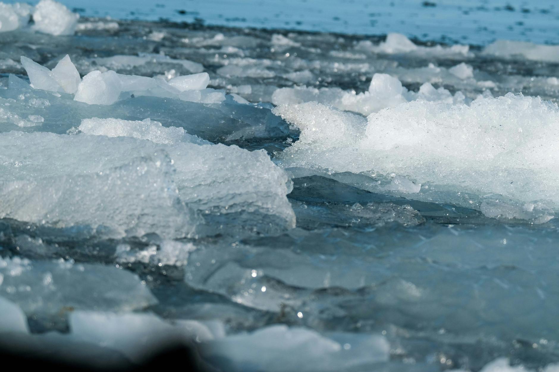 Close-up of ice-cold water with bubbles, representing cold therapy treatment