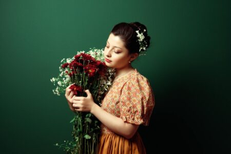 Collection of vintage hair clips and barrettes displayed on wooden surface