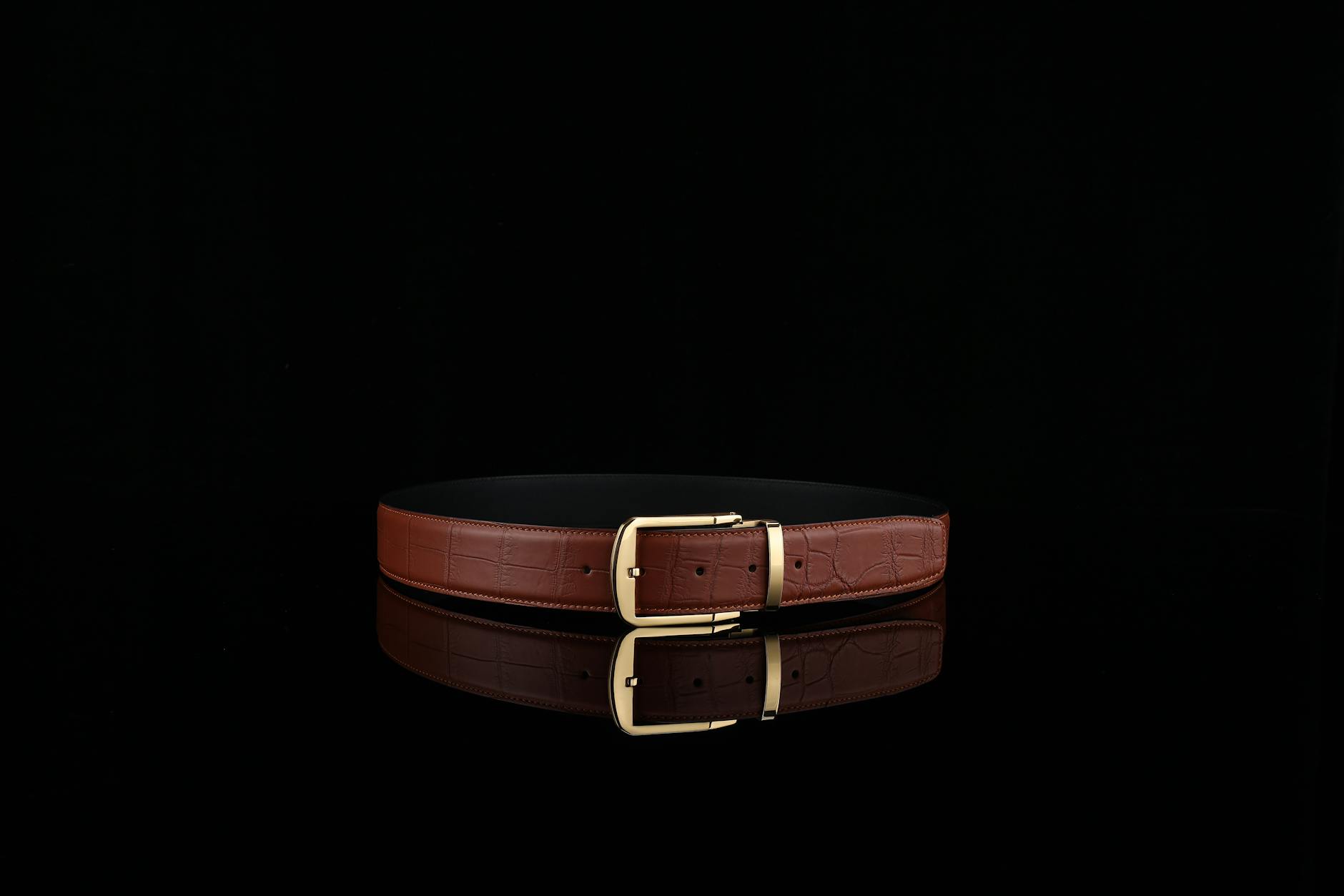 Premium leather belt and accessories showing luxury craftsmanship and modular design elements