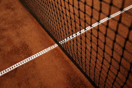 Well-maintained tennis court at an upscale country club facility
