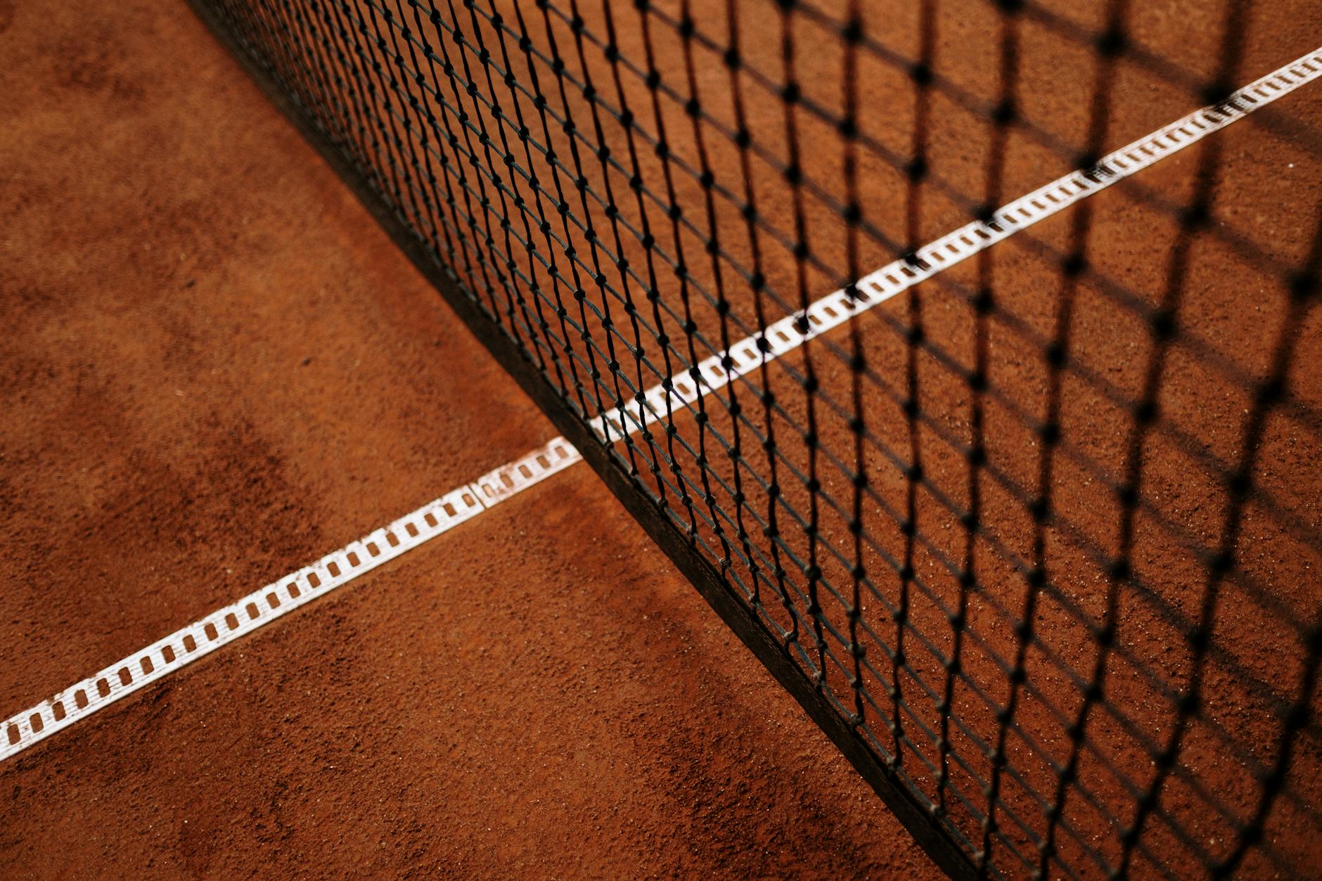 Well-maintained tennis court at an upscale country club facility