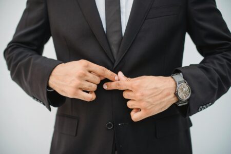 Professional man in minimalist business suit with clean lines and modern tailoring