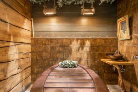 Modern spa interior with salt-lined walls and ambient lighting for halotherapy treatment