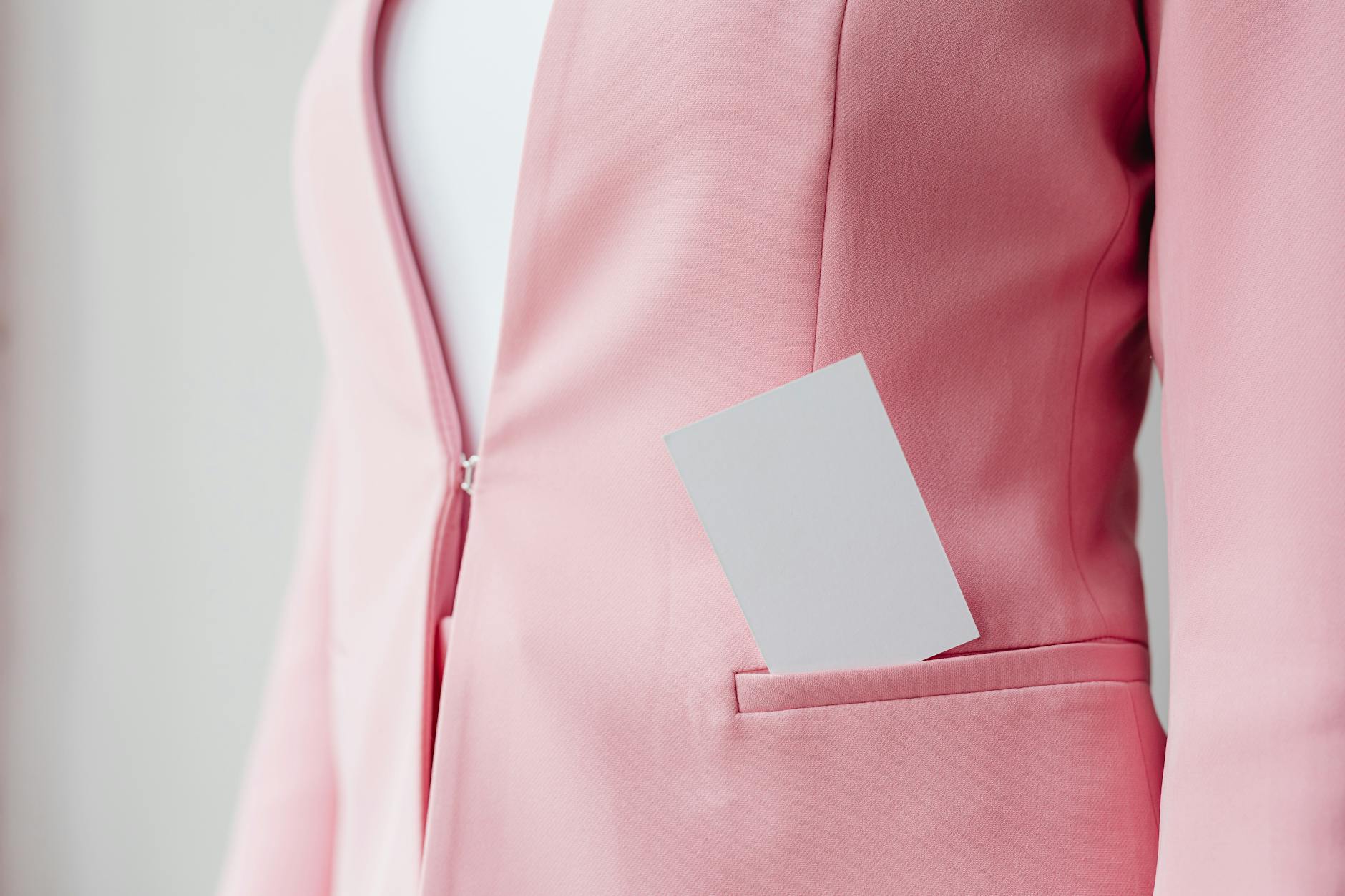 Professional woman wearing a structured blazer in modern office setting