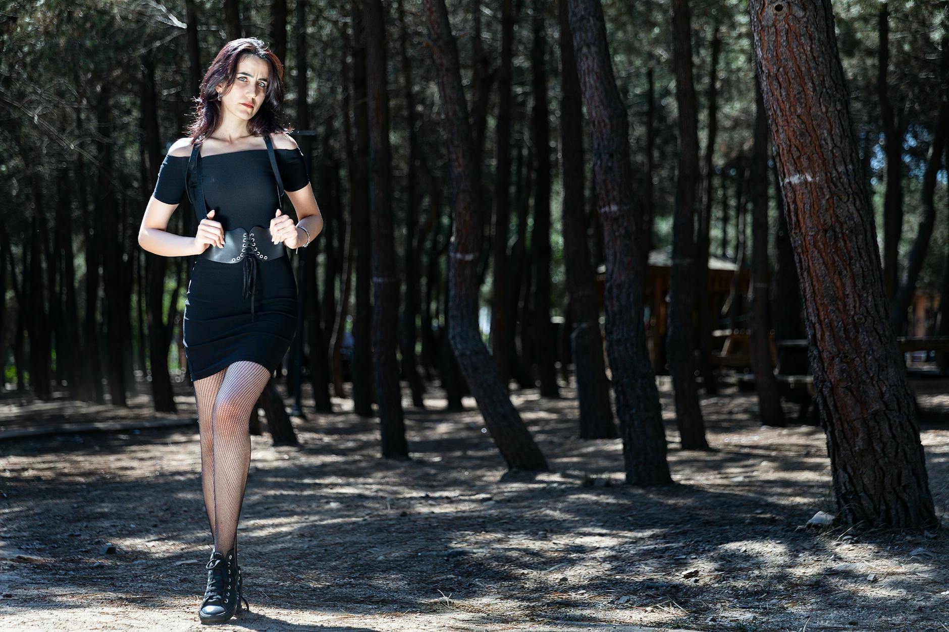 Elegant black dress representing traditional memorial fashion worn by woman in formal setting