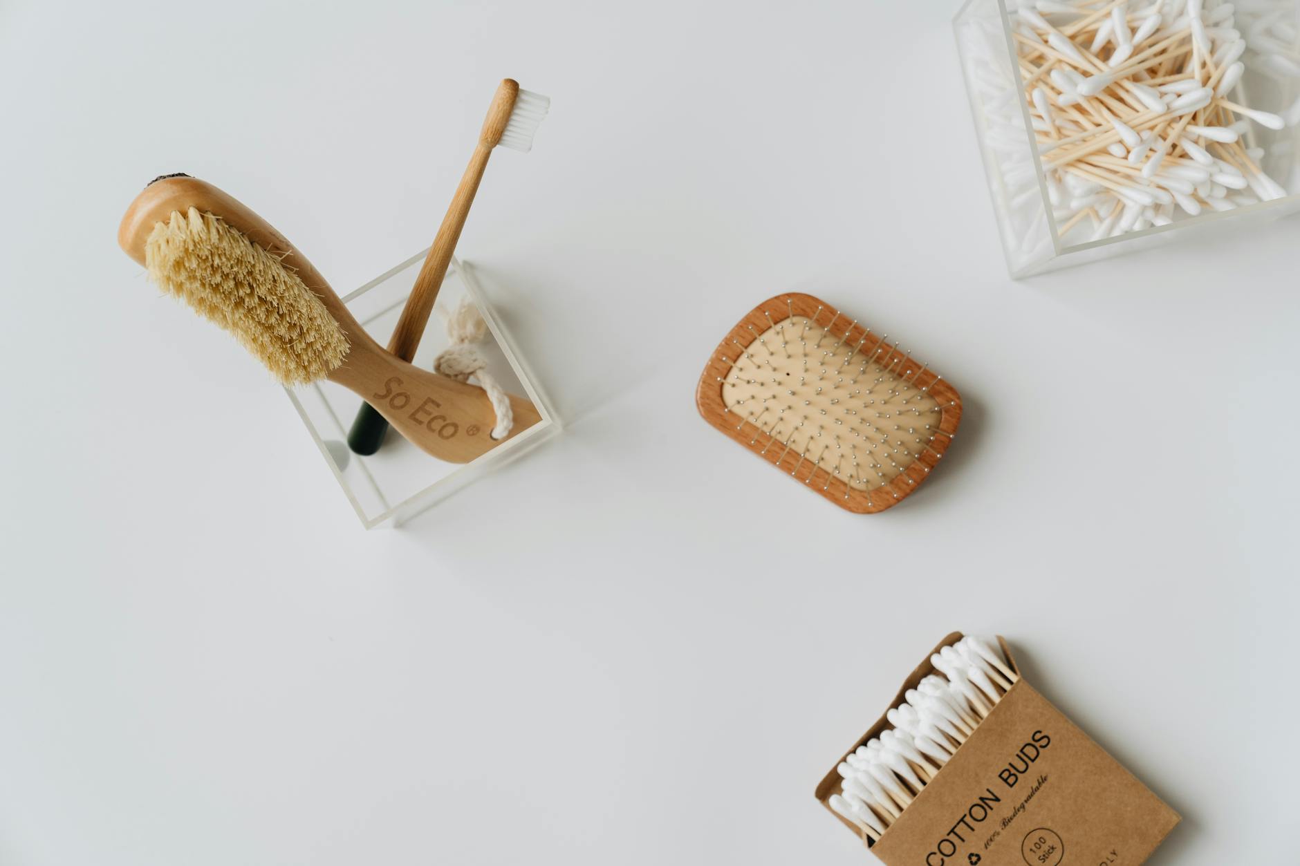 Collection of eco-friendly beauty tools and products arranged on a clean surface