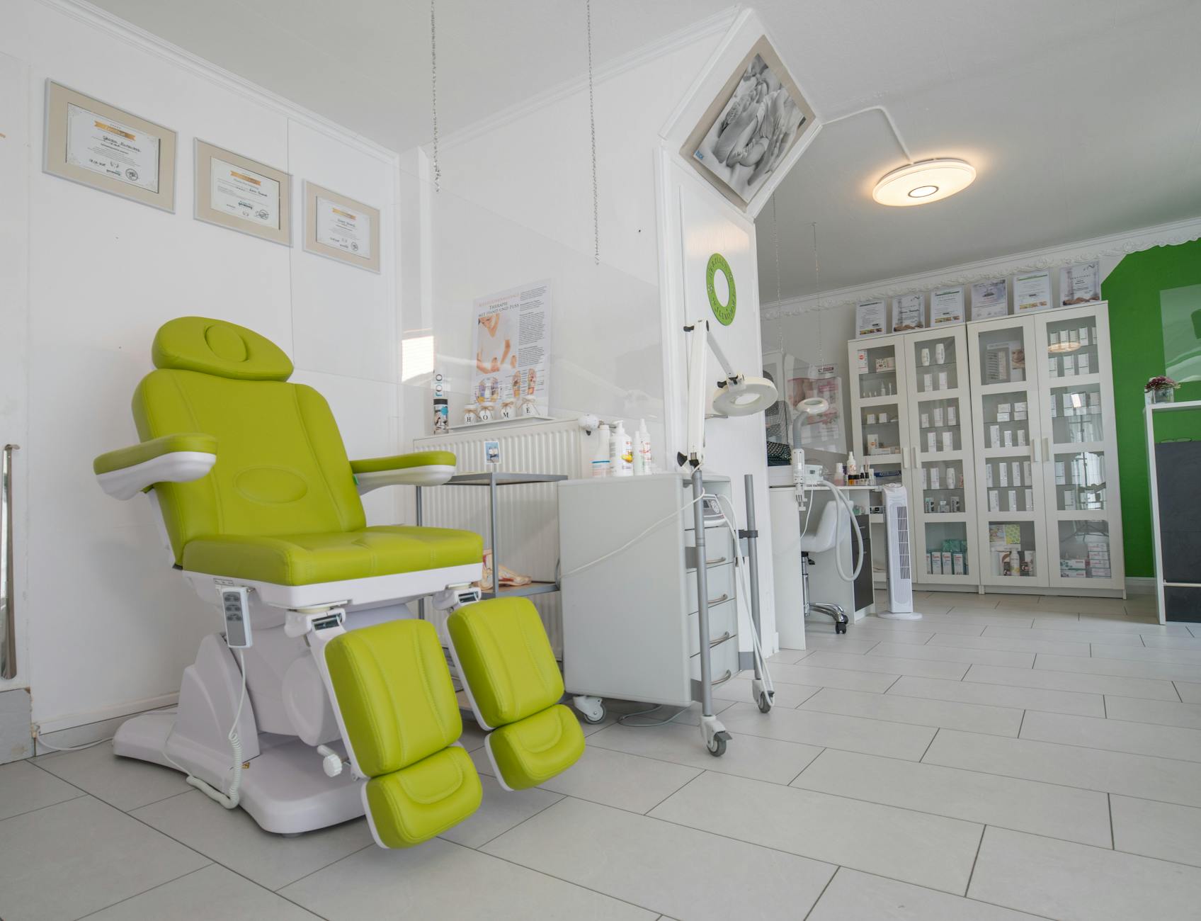 Modern dermatology clinic treatment room with professional equipment and clean surfaces