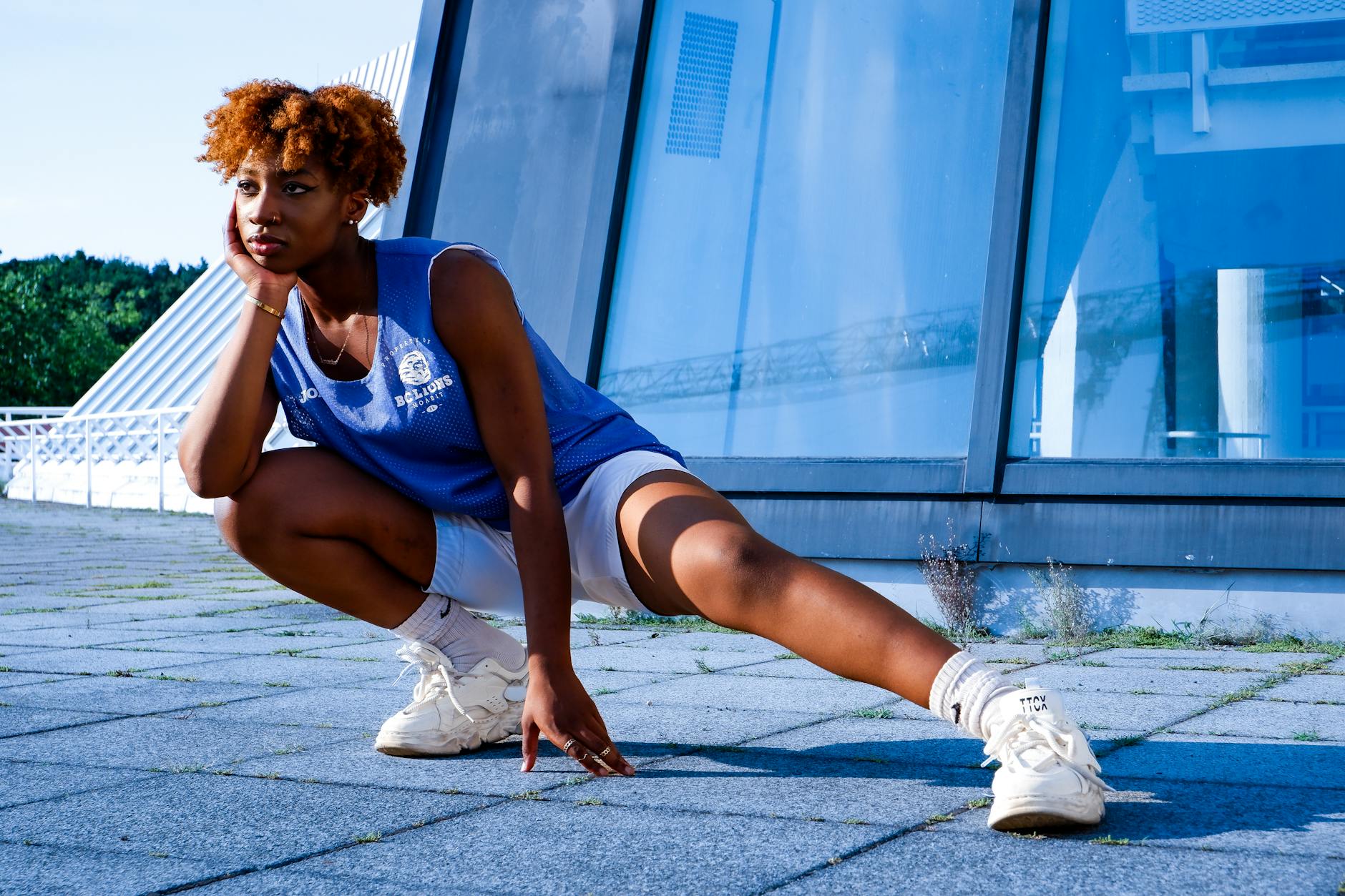 Modern athleisure clothing displayed on hangers showing functional design details