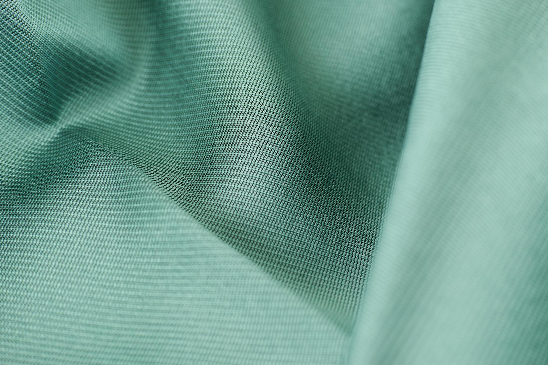 Close-up view of smooth silk fabric showing luxurious texture and sheen