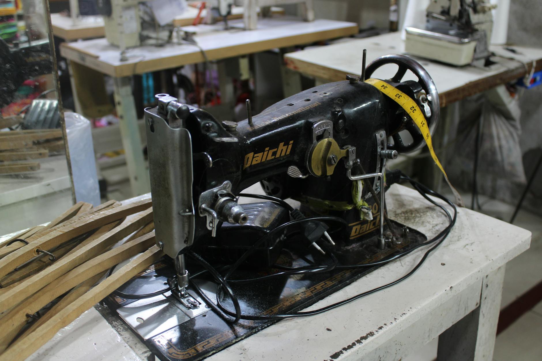 Modern embroidery machine working on fabric for custom fashion piece