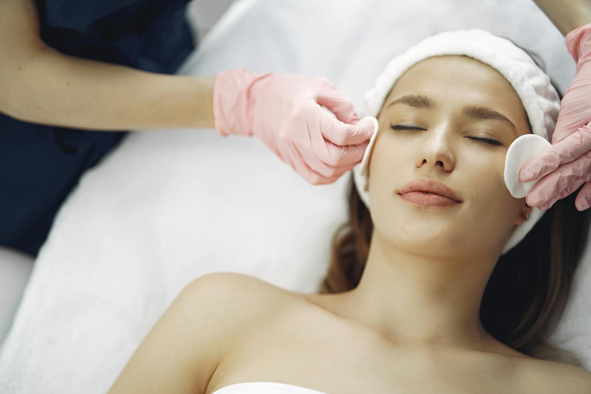 Professional beauty treatment being performed in clinical setting