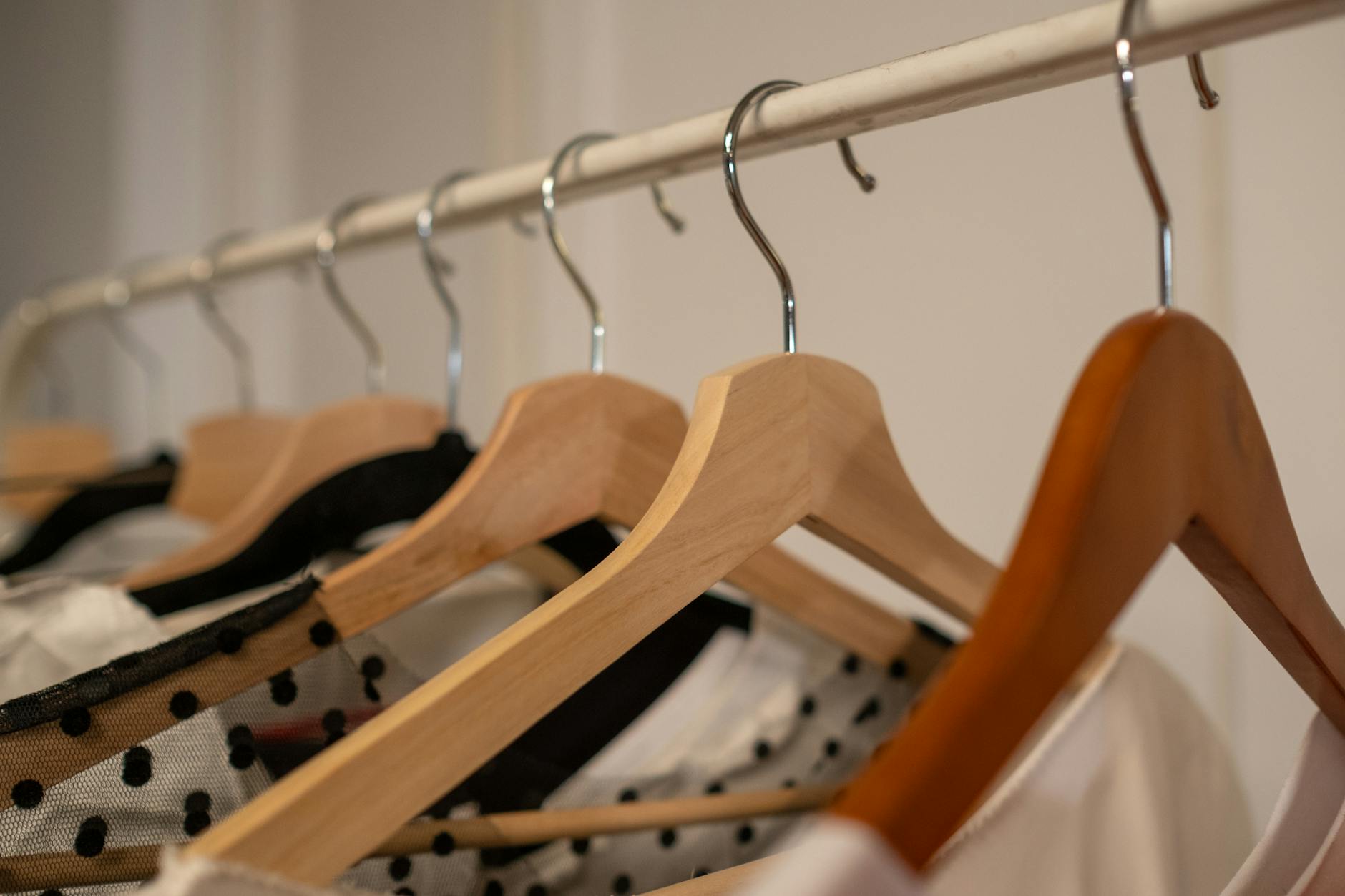Professional clothing hanging in wardrobe showing work-appropriate attire options