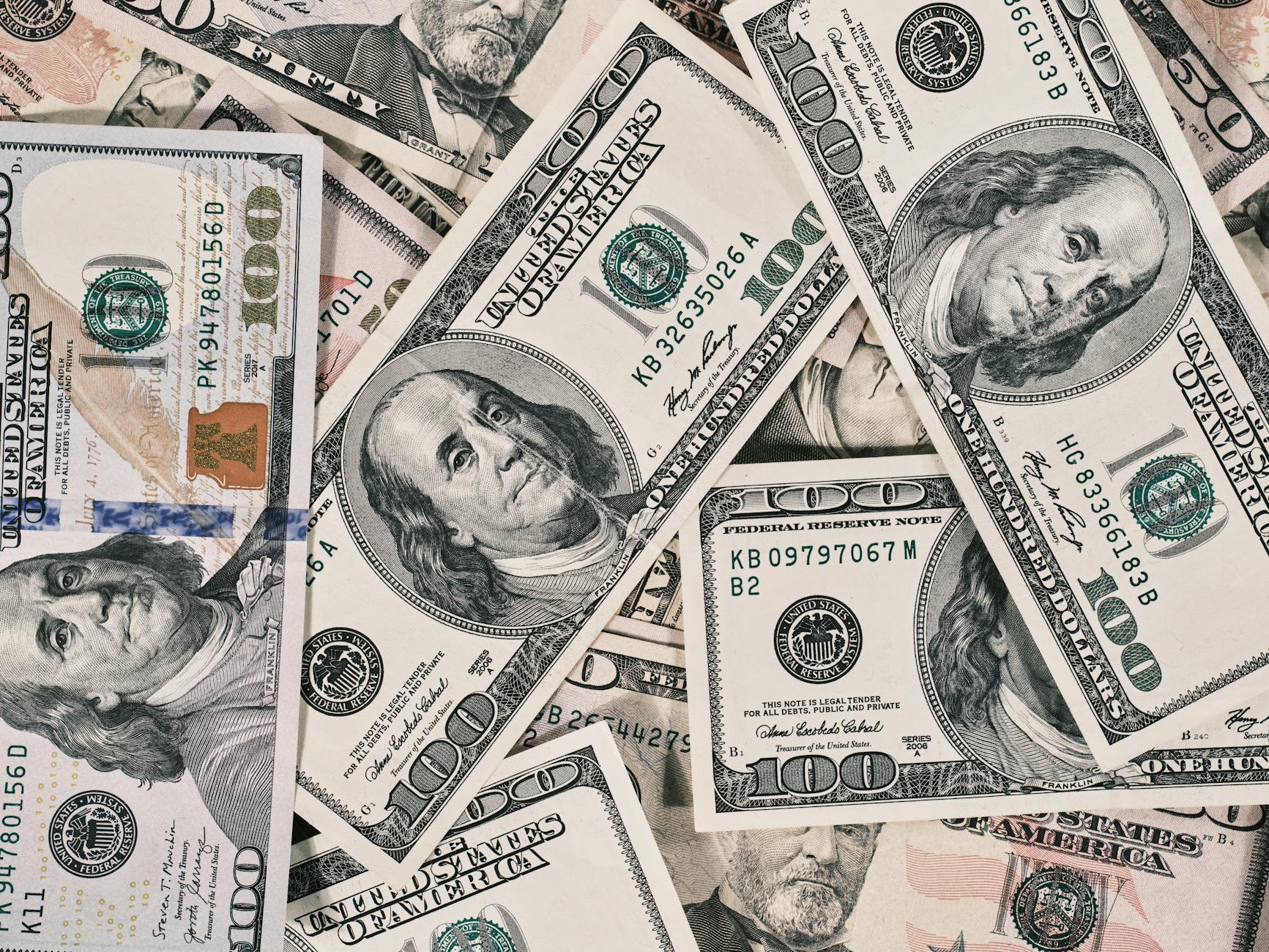 Young woman examining designer handbag in boutique setting