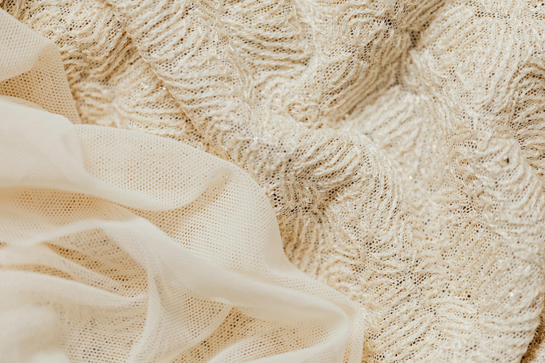 Close-up view of luxury fabric showing intricate weave and texture details  