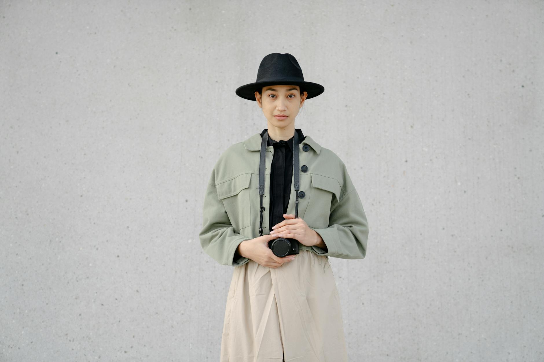 Clean, minimalist styling showing layered clothing with neutral tones
