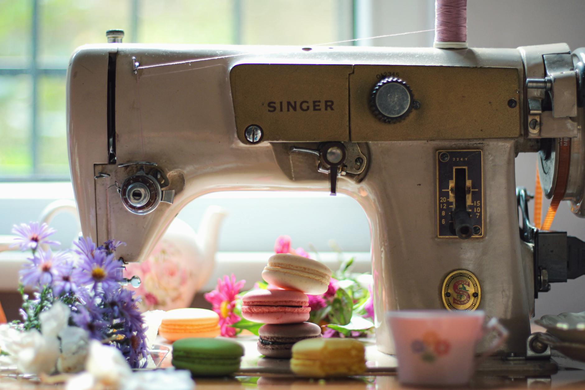 Vintage sewing machine with fabric showing traditional repair work and mending techniques