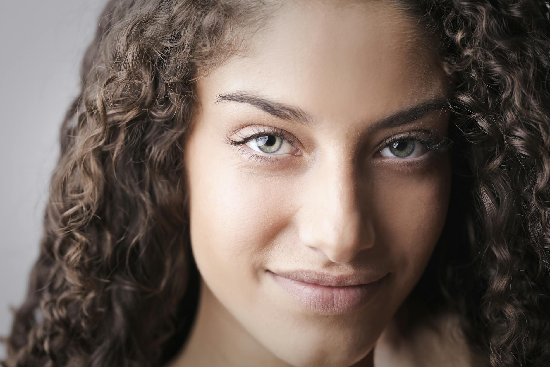 Woman practicing morning wellness routine in natural lighting