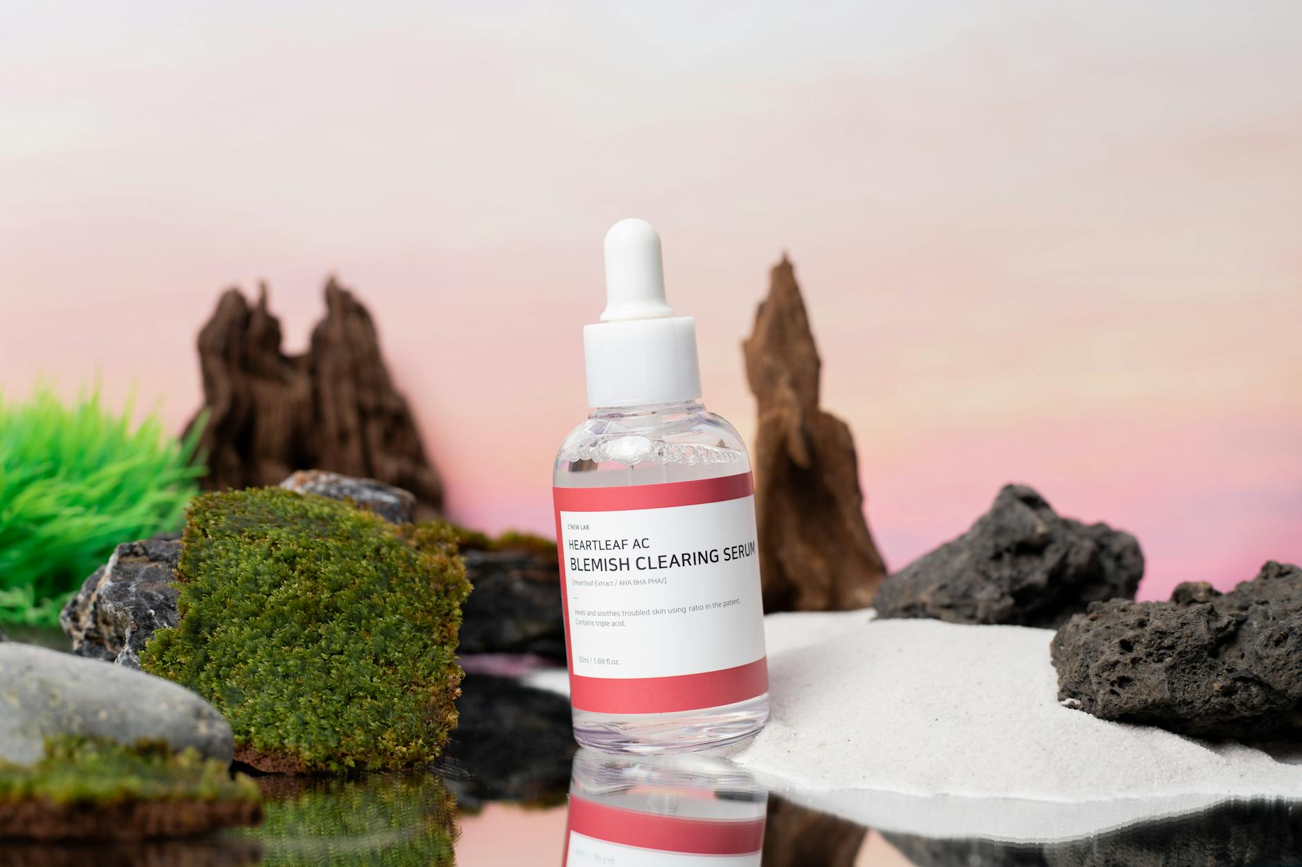 Glass serum bottle with dropper containing probiotic skincare product