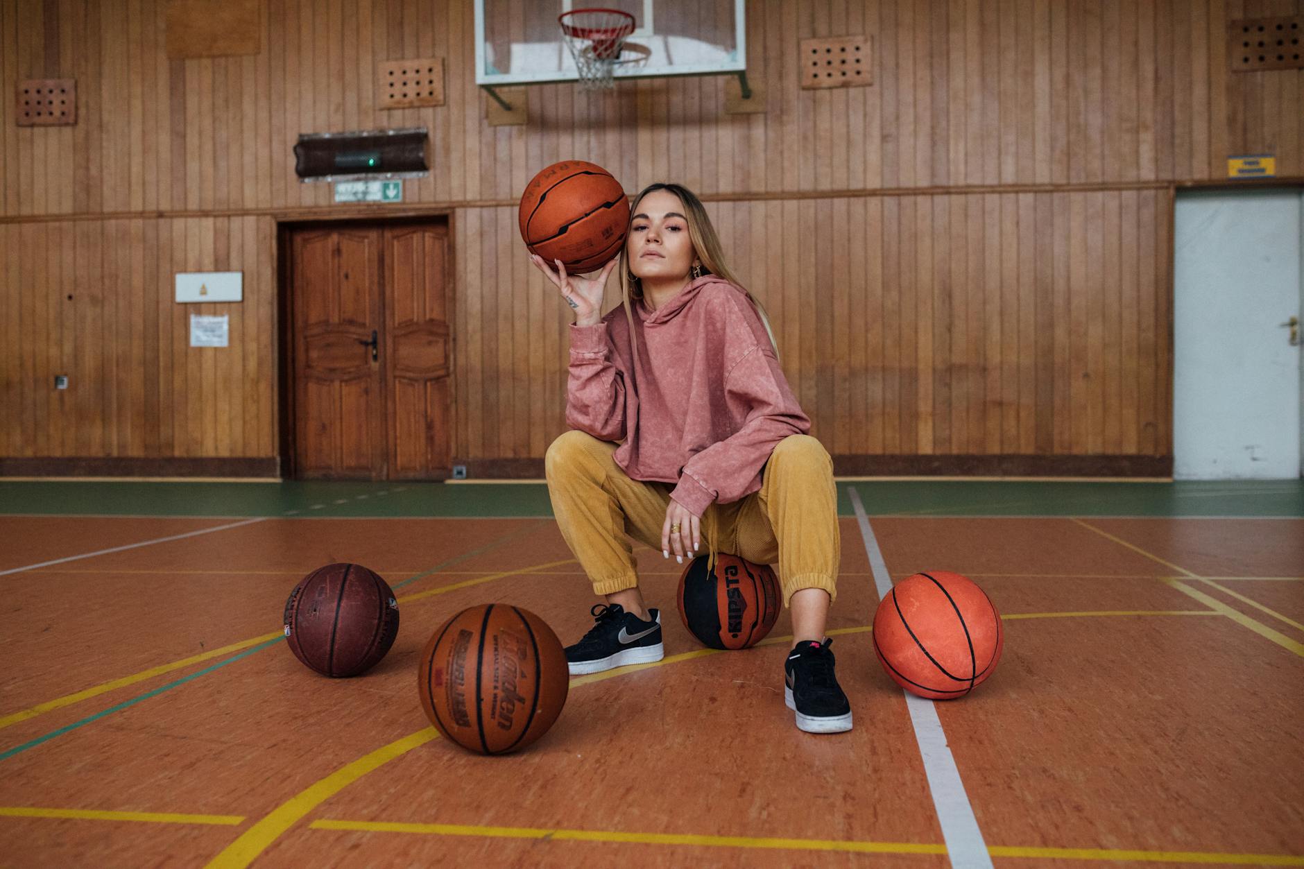 Professional athlete wearing compression sleeves with casual streetwear outfit