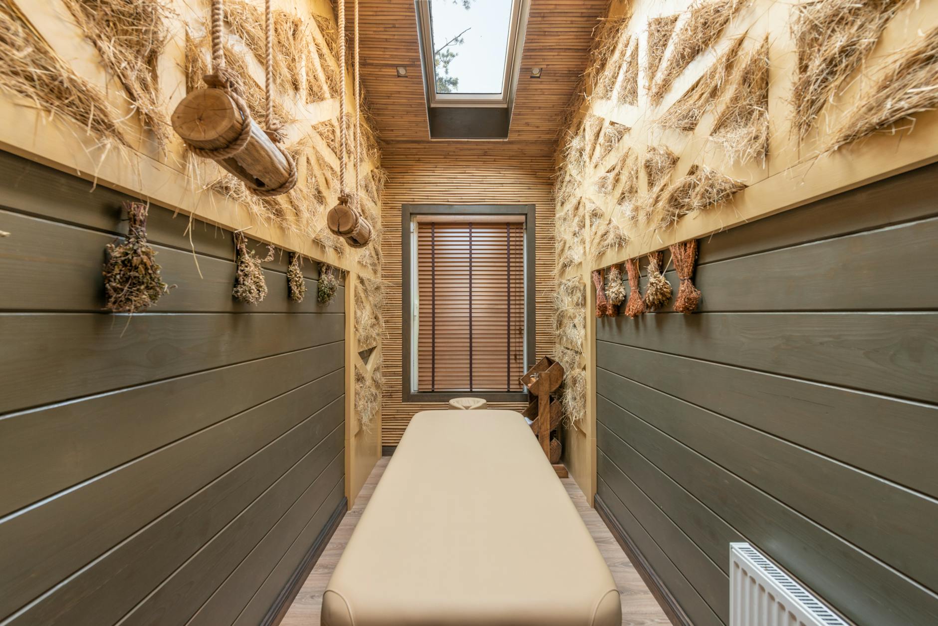 Peaceful spa treatment room with comfortable seating and calming atmosphere