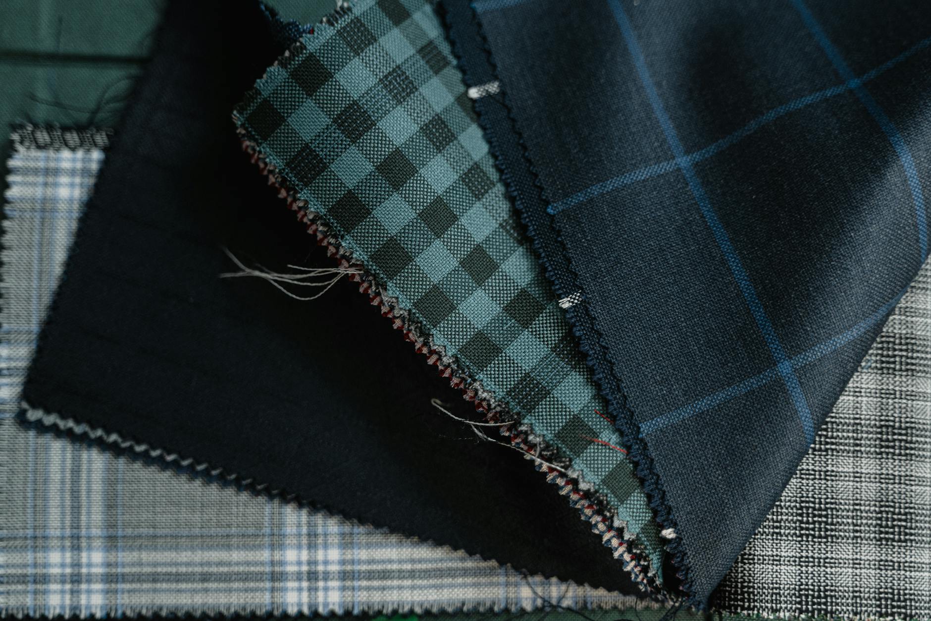 Close-up detail of high-quality wool suit fabric showing fine craftsmanship and texture