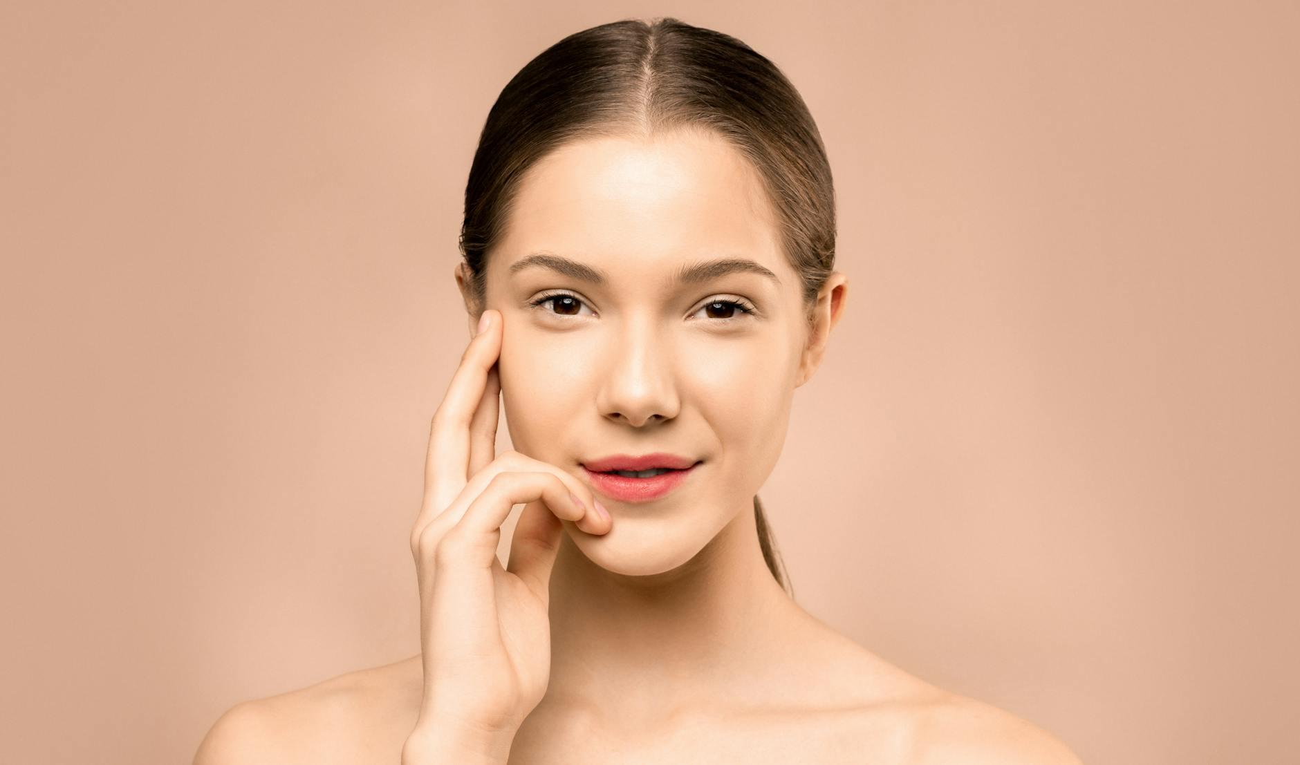 Close-up portrait showing luminous, glass-like skin finish