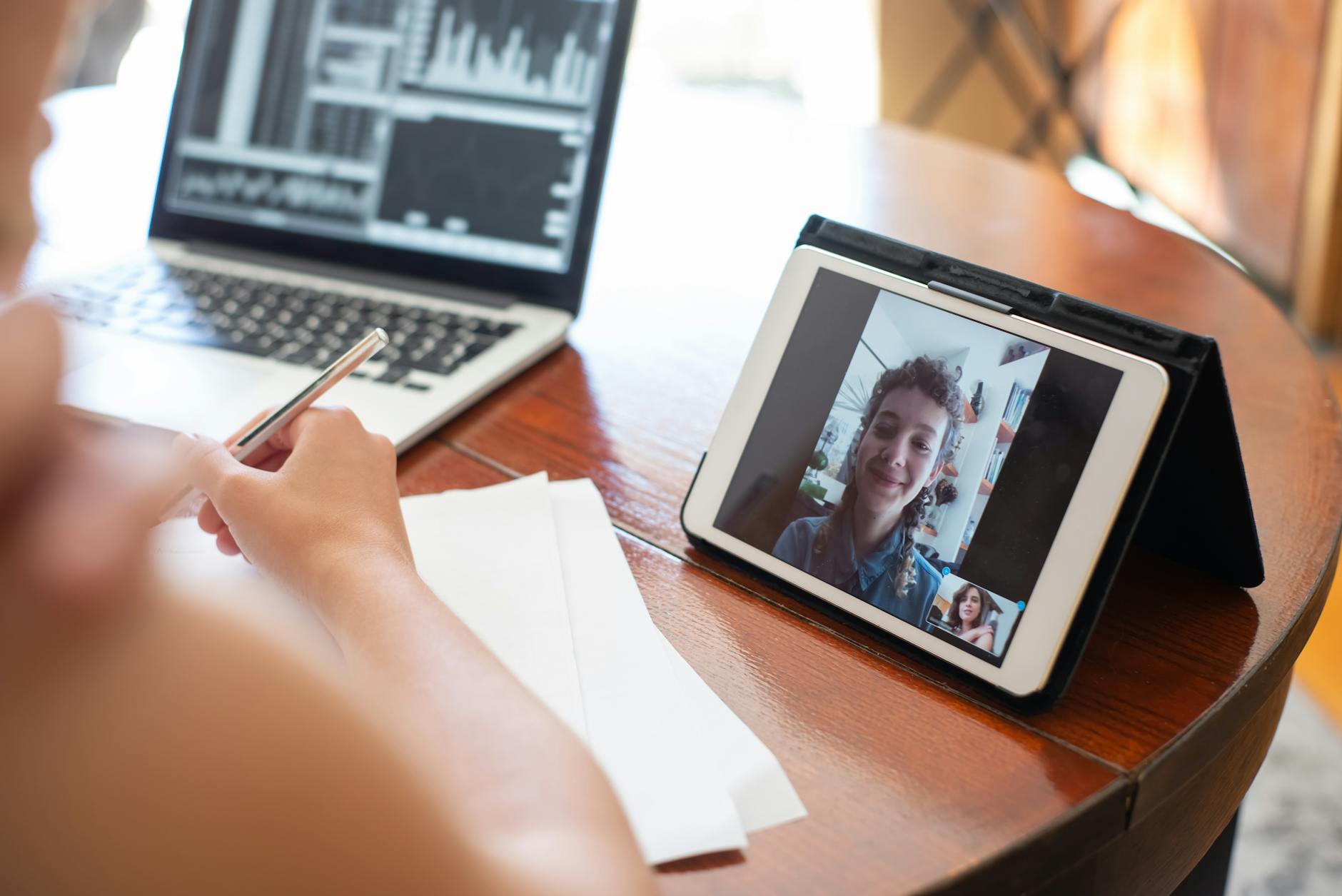 Person participating in video conference call from home office