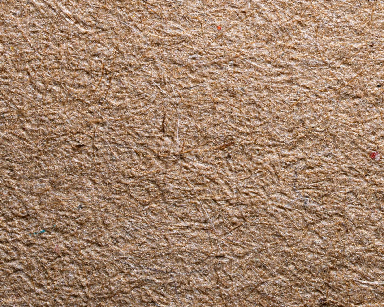 Display of various eco-friendly materials and textiles arranged on wooden surface