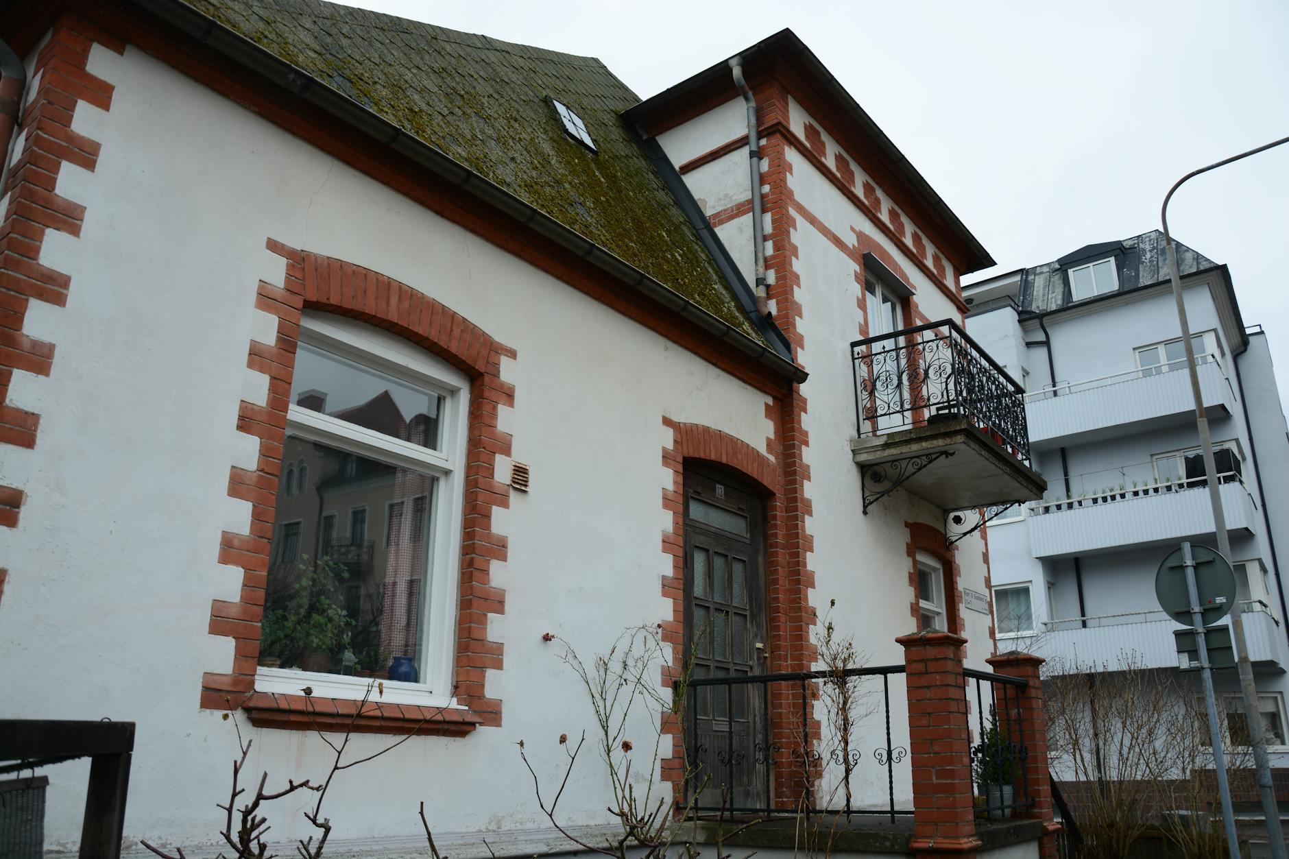 Professional auction house setting where vintage fashion items are sold