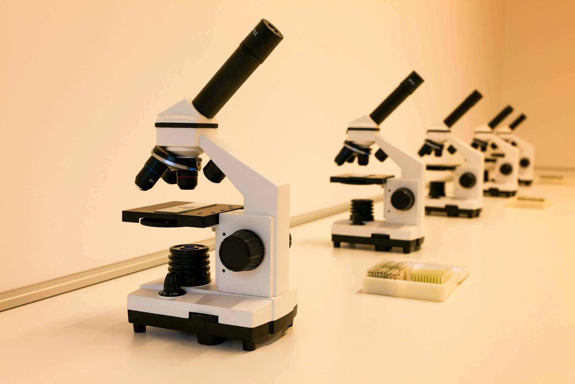 Professional cosmetic laboratory with mixing equipment and color analysis tools for custom foundation formulation