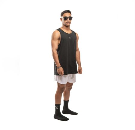 Loose mesh athletic pinnie vest laid flat showing open-weave fabric and numbered chest detail