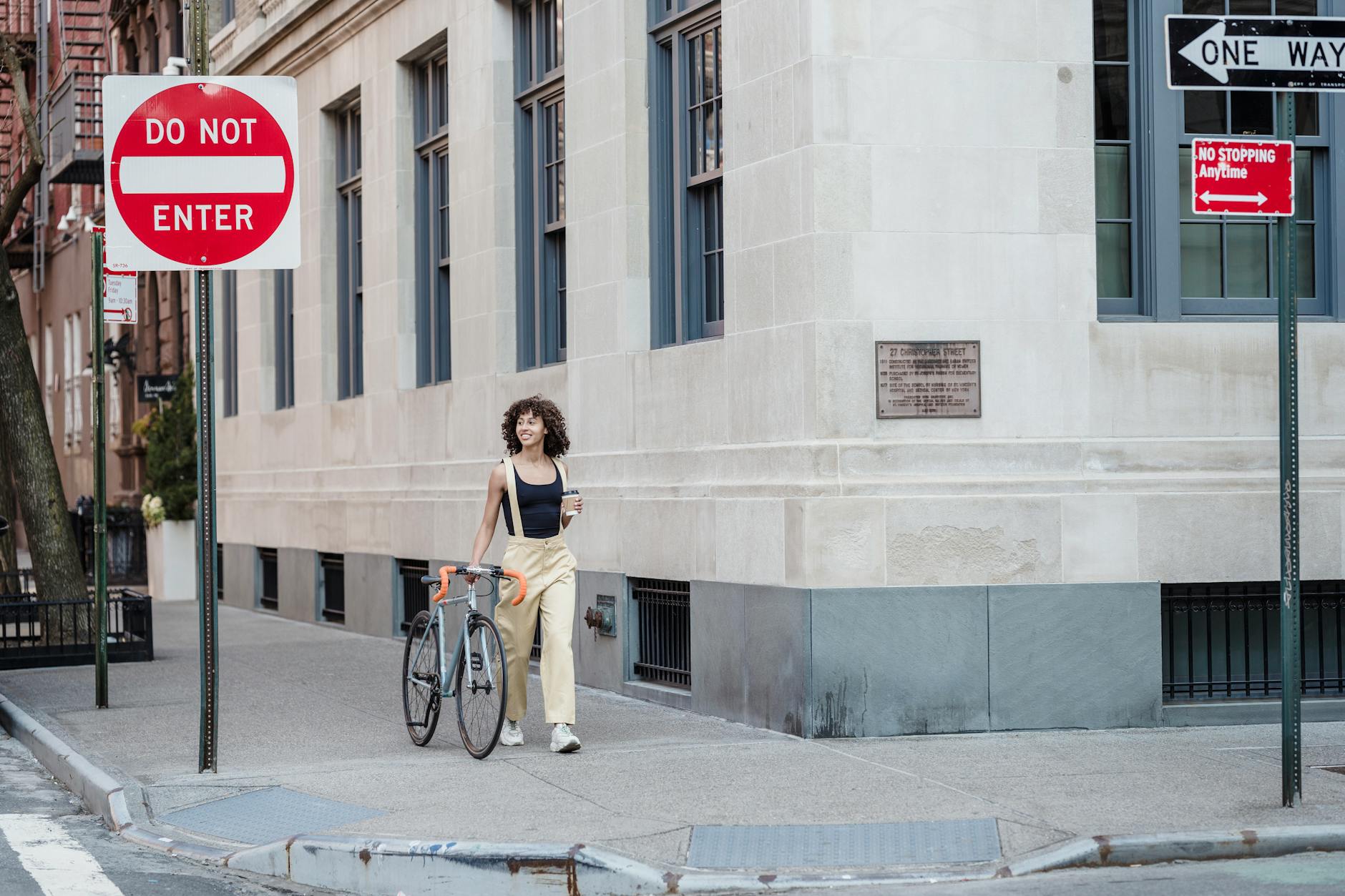 Downtown New York street style look featuring layered athletic and tailored clothing pieces