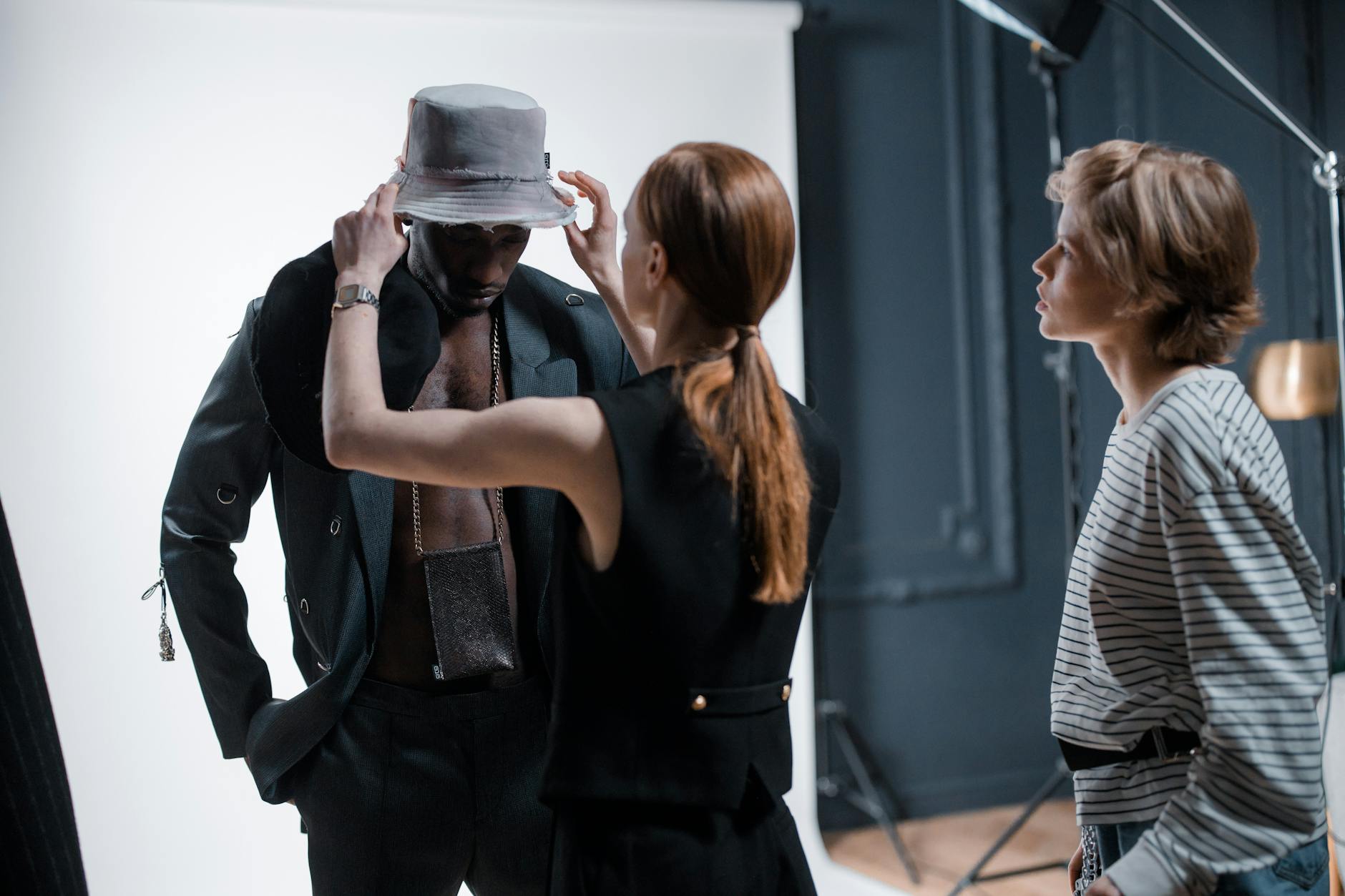Editorial fashion accessories laid out in a studio setting showing varied textures and materials