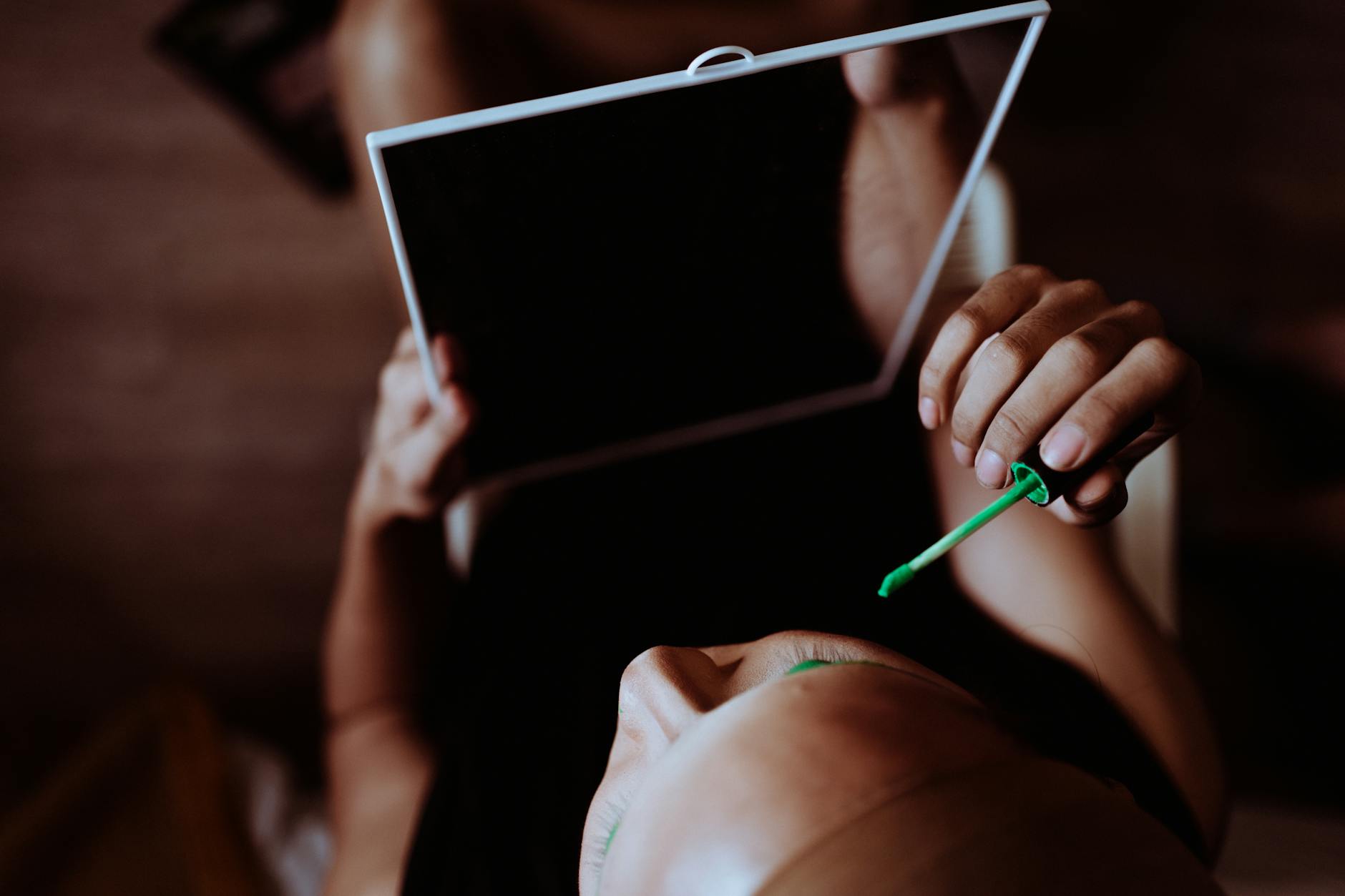 Close-up of someone applying natural-looking makeup with a brush