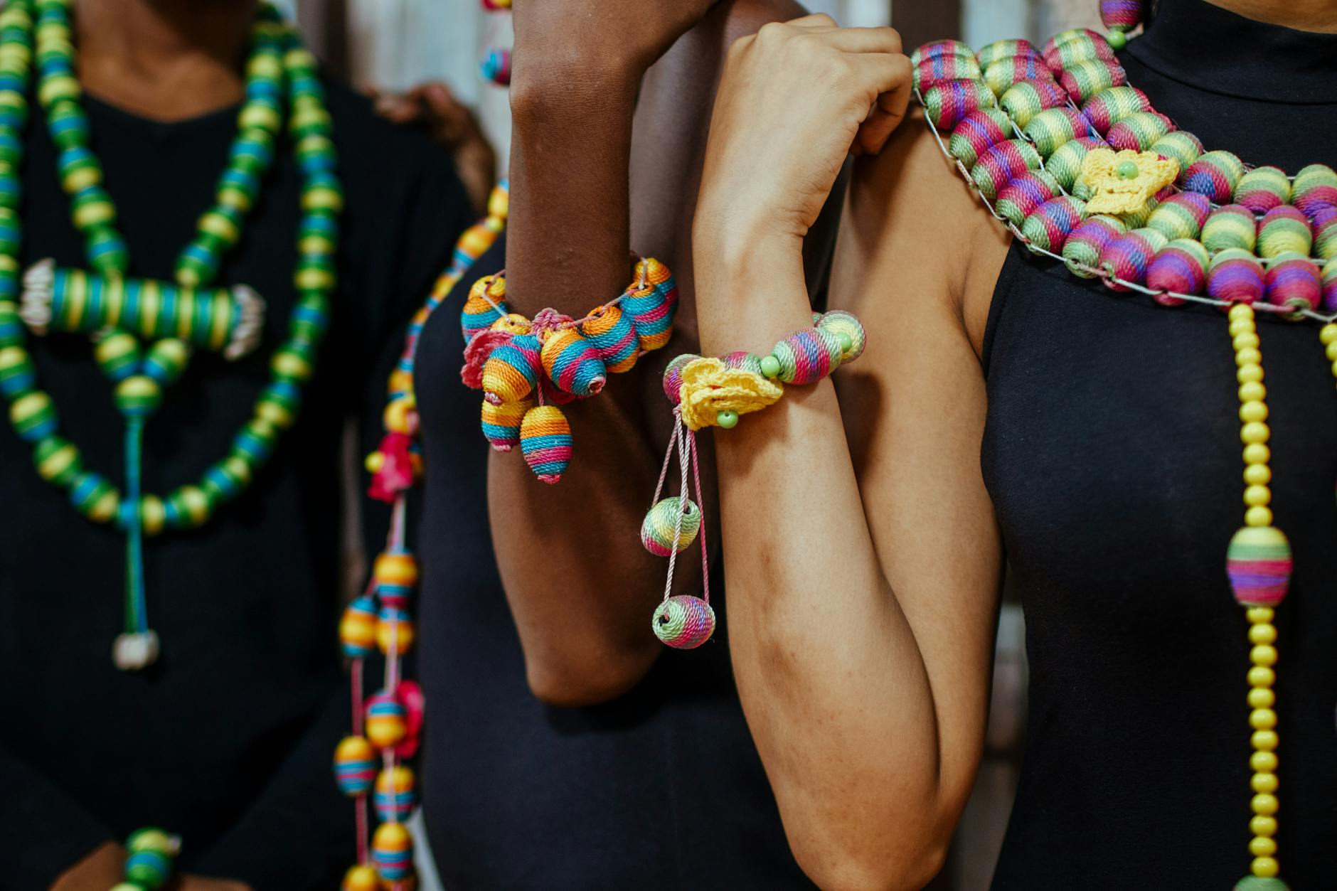 Bold statement jewelry and expressive accessories laid out on a flat surface, representing the shift away from minimalist fashion