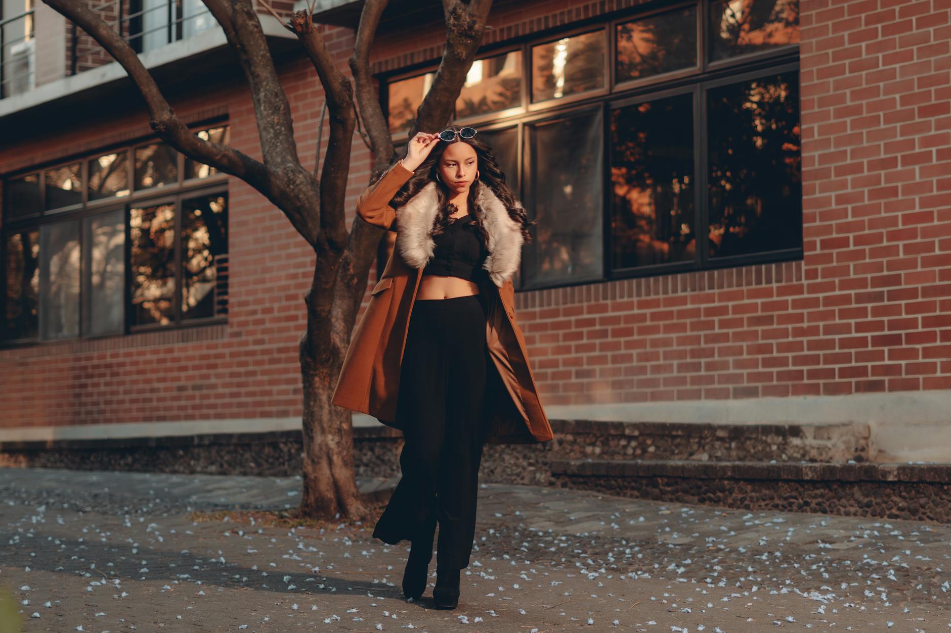 Stylishly dressed person wearing mixed vintage and contemporary clothing pieces