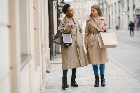 Judo Gi Silhouettes Are Folding Into Luxury Outerwear This Season Model wearing a structured wrap coat with wide lapels and belted waist in a minimal fashion setting