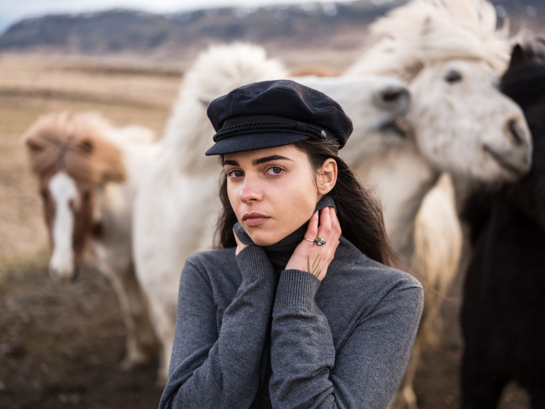 Woman wearing a fitted ribbed polo collar top in a neutral tone
