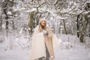 A thick knit polo neck scarf draped over a wool coat at the collar