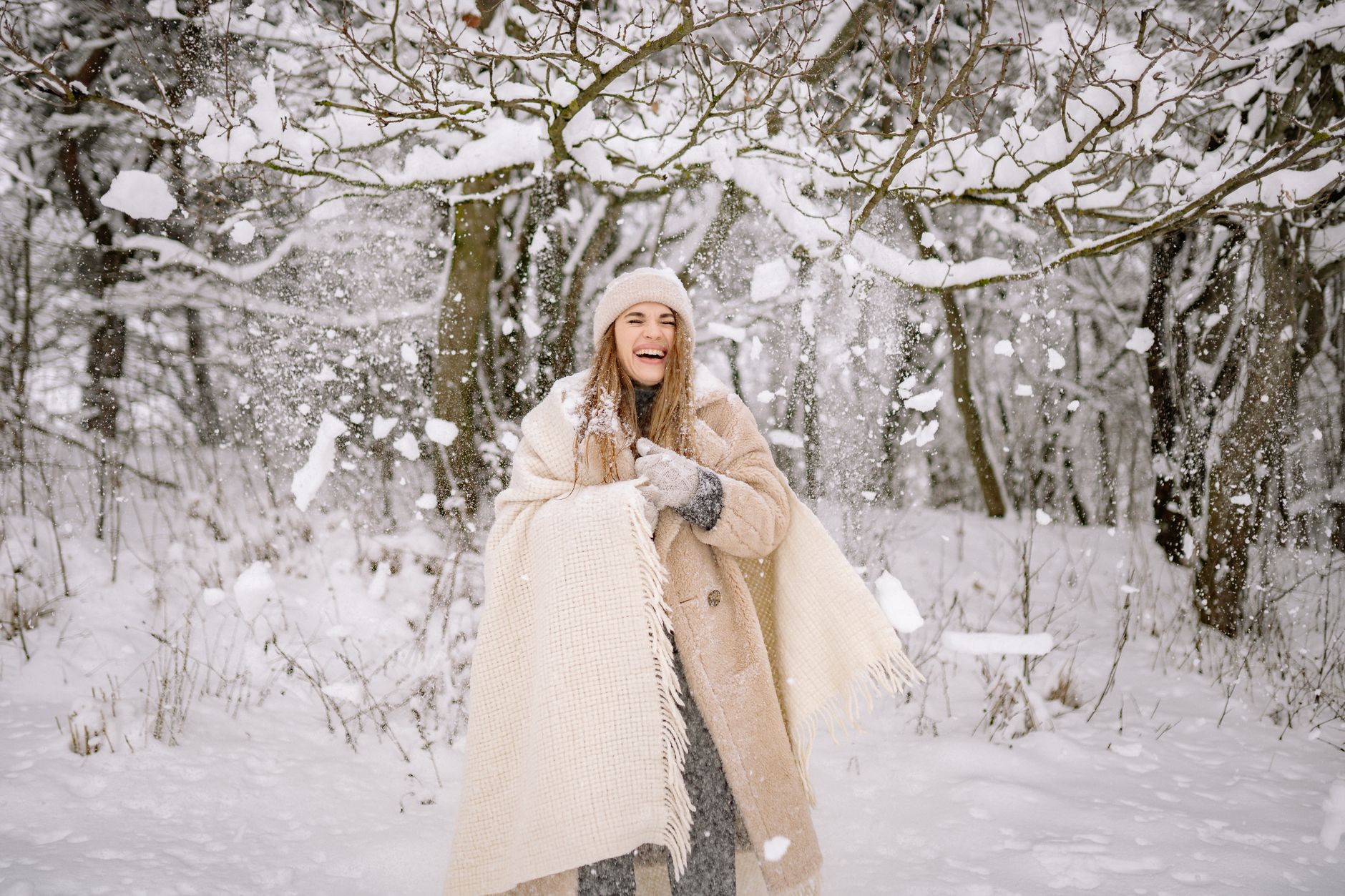 A thick knit polo neck scarf draped over a wool coat at the collar