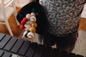 Polo Croquet Mallets Are Quietly Reshaping Luxury Bag Straps Close-up of a wooden croquet mallet handle showing wrapped leather grip detail