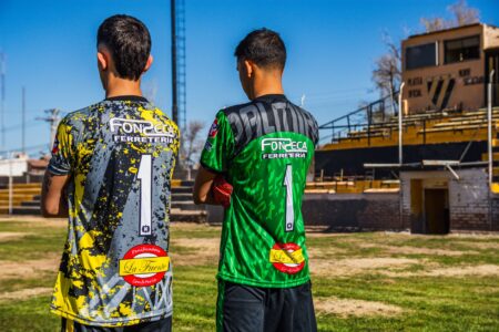 Brightly colored athletic sports jersey laid flat on a surface