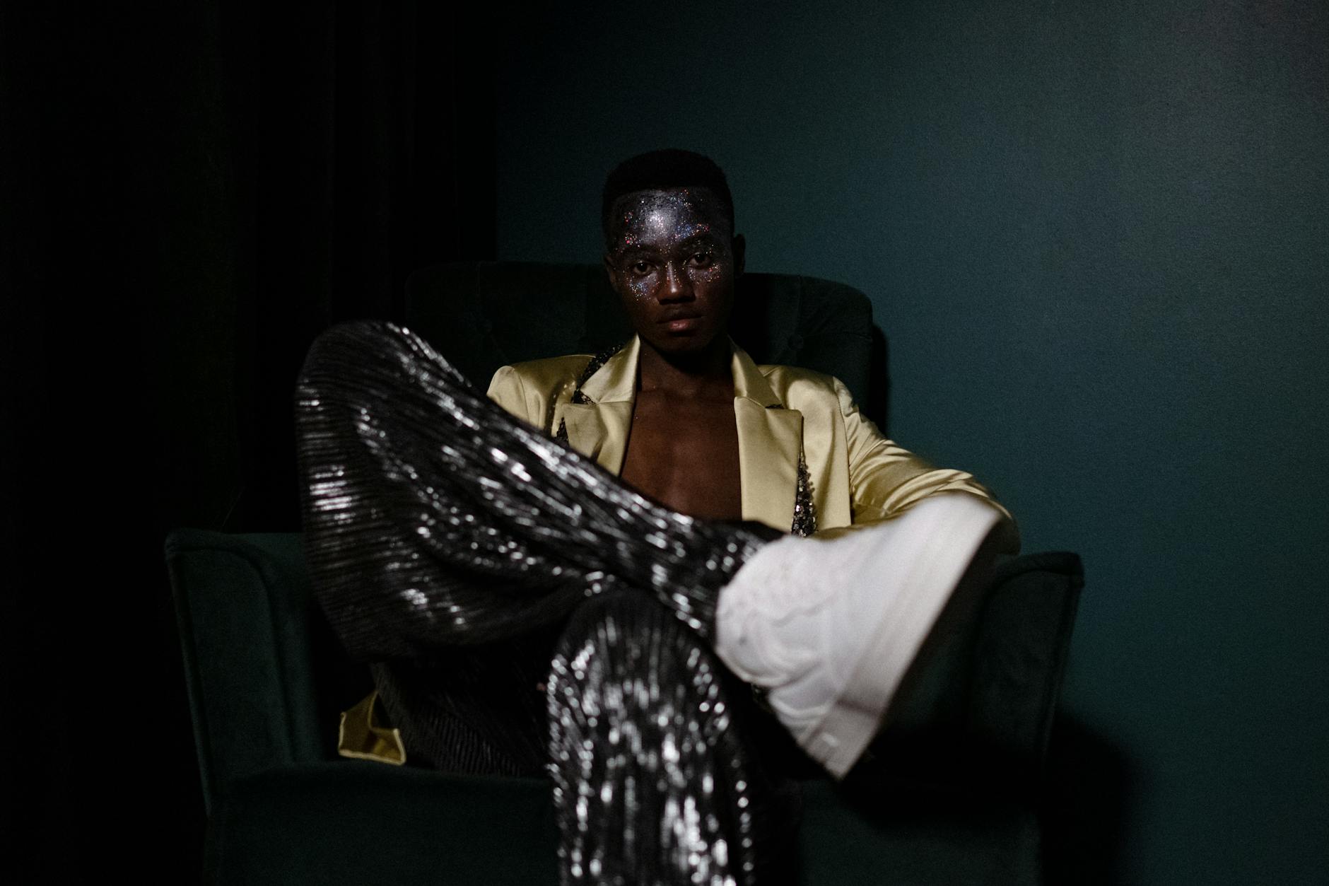 Model wearing structured headwear in a high-contrast luxury fashion editorial setting