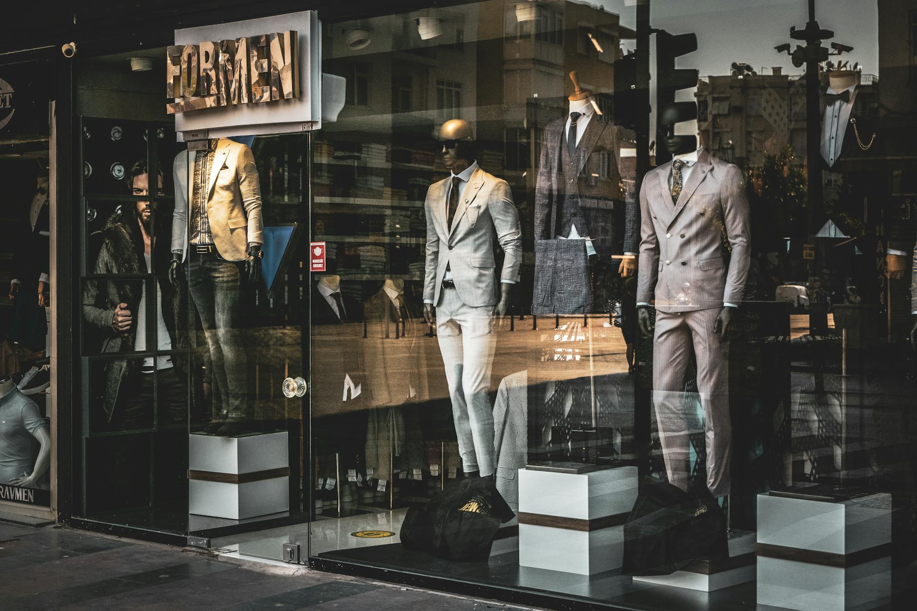 Interior of a contemporary menswear boutique with structured jackets on display