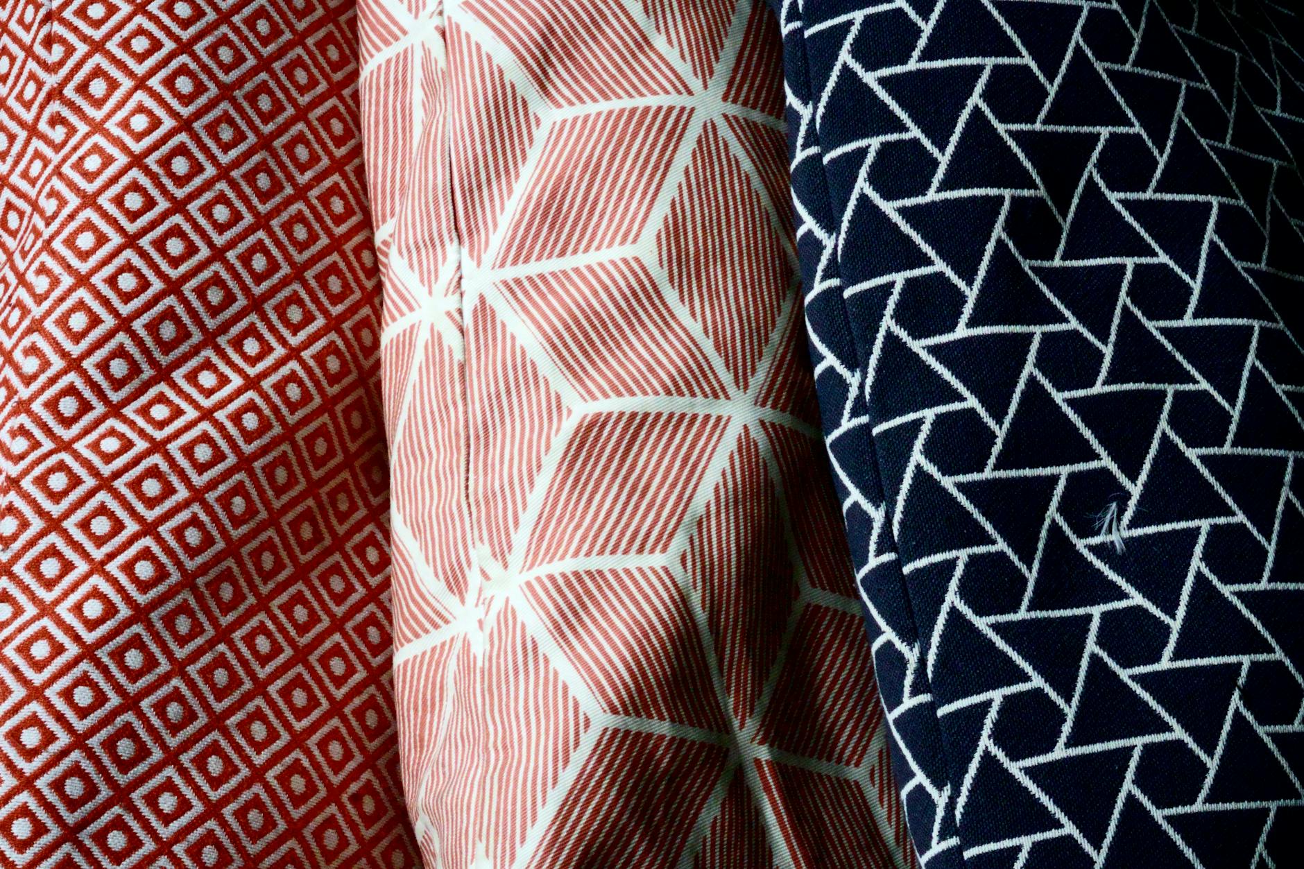 Close-up of dense woven cotton fabric texture showing visible weave structure and matte finish