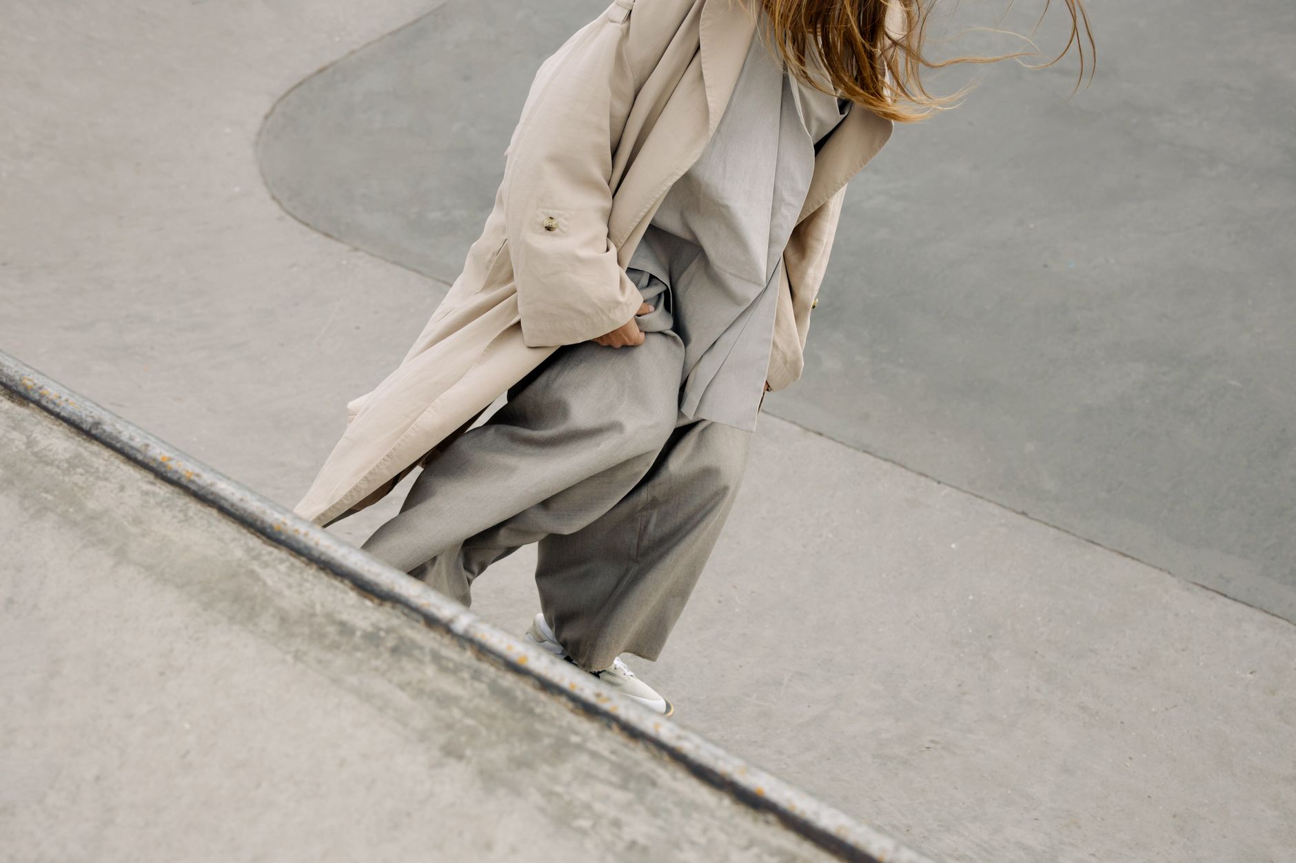 Minimalist streetwear outfit with clean lines and wrapped accessory details